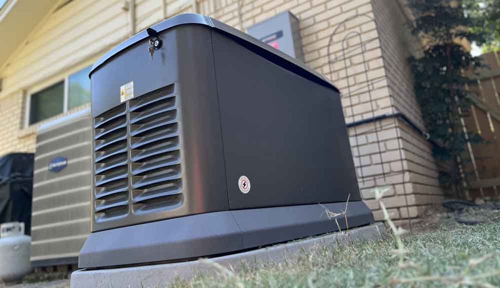 Whole-home standby generator installed beside a house